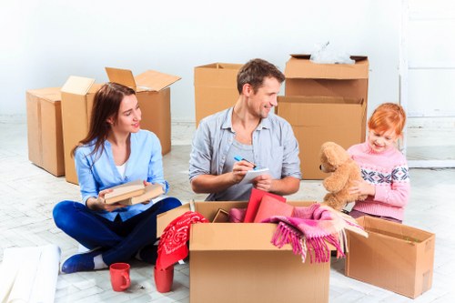 Local moving team handling bulky furniture in central London