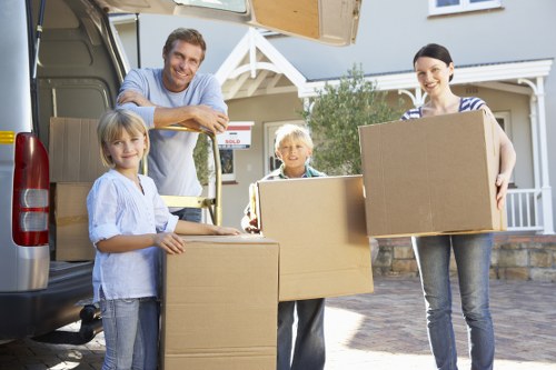 Two movers carrying boxes in Marylebone flat move