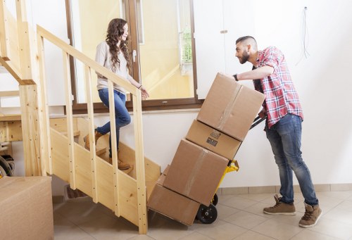 Trained movers handling items with protective equipment